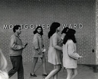 Cesar Chavez outside Montgomery Ward with Chicana labor organizers 
